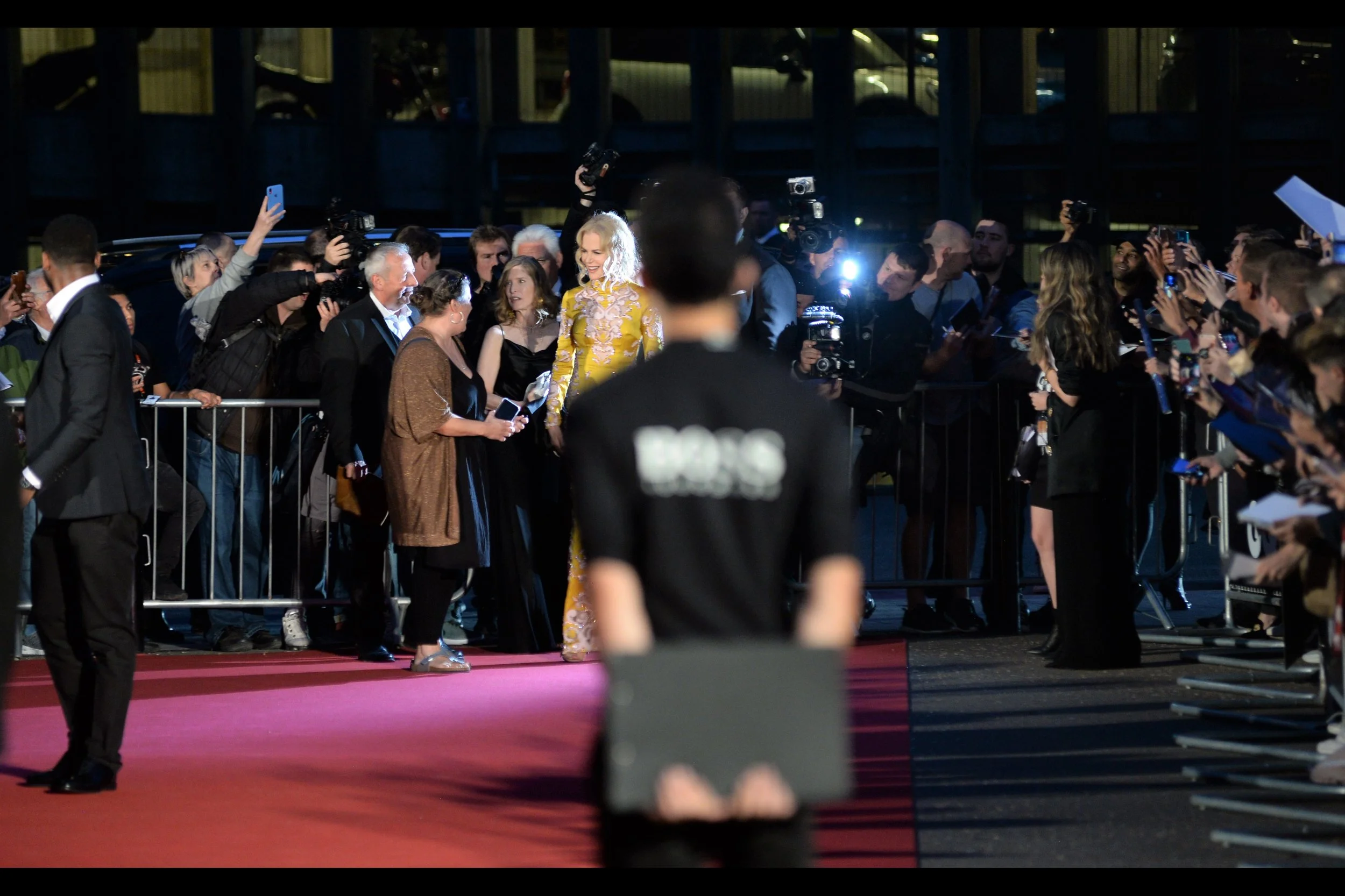 It’s Australia’s Own Nicole Kidman!!!! And that guy with his t-shirt with a clipboard is STILL. STANDING. RIGHT. THERE. He has not moved in an Hour. What do they ask people like him when they apply for a job? “Do you look good blurry in photos?” Because I’m curious. Get in touch, Boss T-Shirt Clipboard Guy… tell me your dreams. What do you want to accomplish in your life? is this it? Really? (REALLY???)