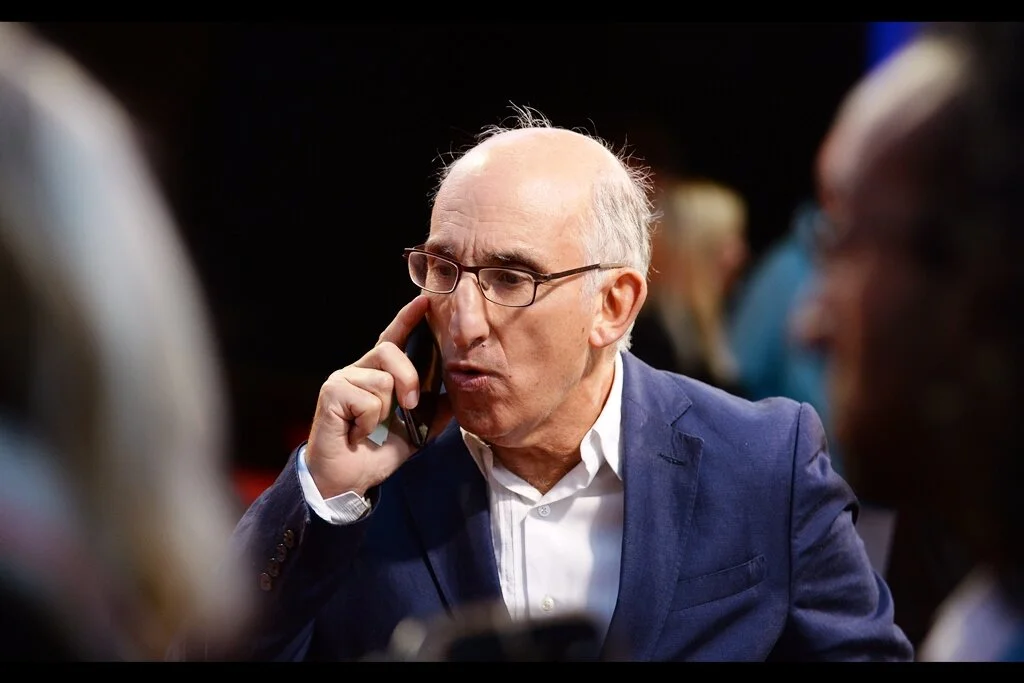 “Jerry? Jerry? Get me five thousand shares at price. What do you mean, you’re an Uber Delivery guy? Is your name Jerry? Then get me those shares, Jerry!” David M Thompson is one of this movie’s 11 producers.