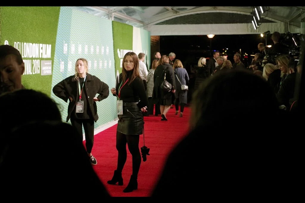 In contrast to prior premieres (and in contrast to earlier in the day) this time I decided I wanted nothing to do with the a55holishness of autograph dealers, or the pushiness of the media, and stood where the FANS were - at the very end of the carpet. (With the look this assistant is giving me, I wonder what I’d be subject to if I was in ANOTHER pen)