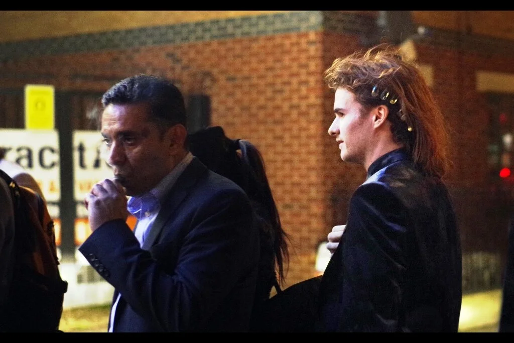 STOP EVERYTHING - this premiere, Brexit, the rotation of the Solar System… I don’t care. Stop it all immediately. THAT MAN ON THE RIGHT IS WEARING A MULLET. AND IT IS AMAZING.
