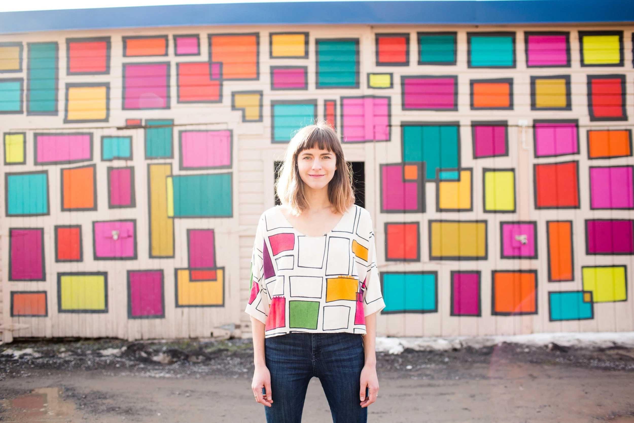 NellieRose in front of the “Happiness Machine”, a public artwork Nellie painted in 2017 thanks to a grant from New Historic Thomas, a non-profit organization in Thomas WV. Photo by Jessica Fike.