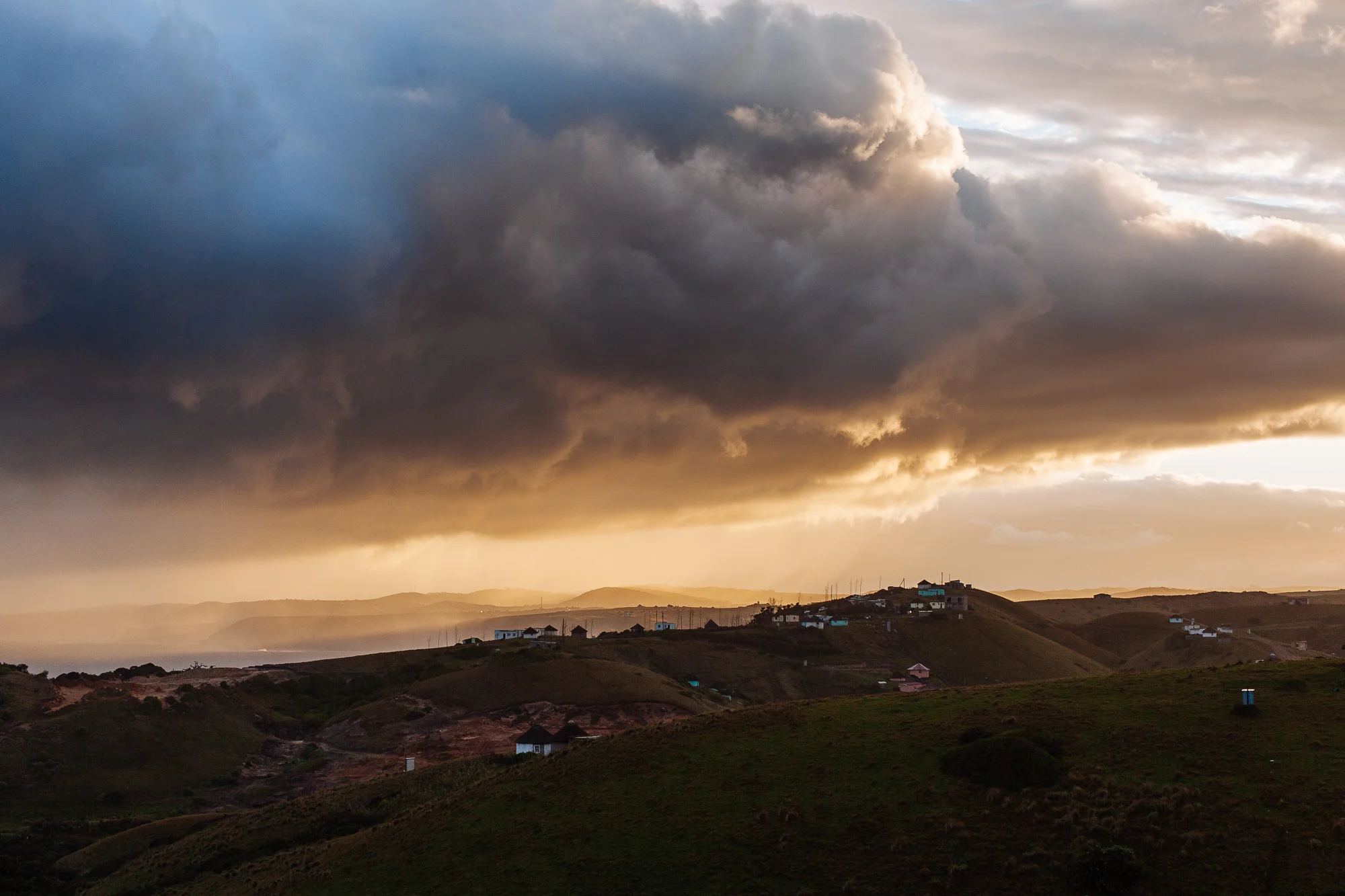 A storm rolls in across the village of Tshani.