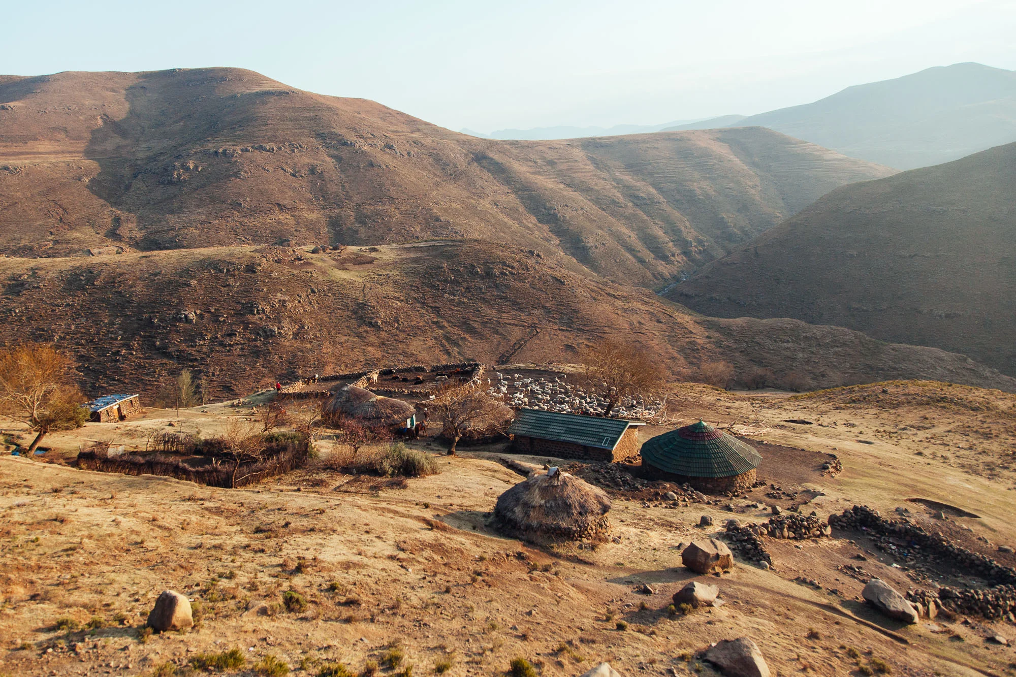 The family's group of rondavels nestled in the Thaba Putsoa Mountains