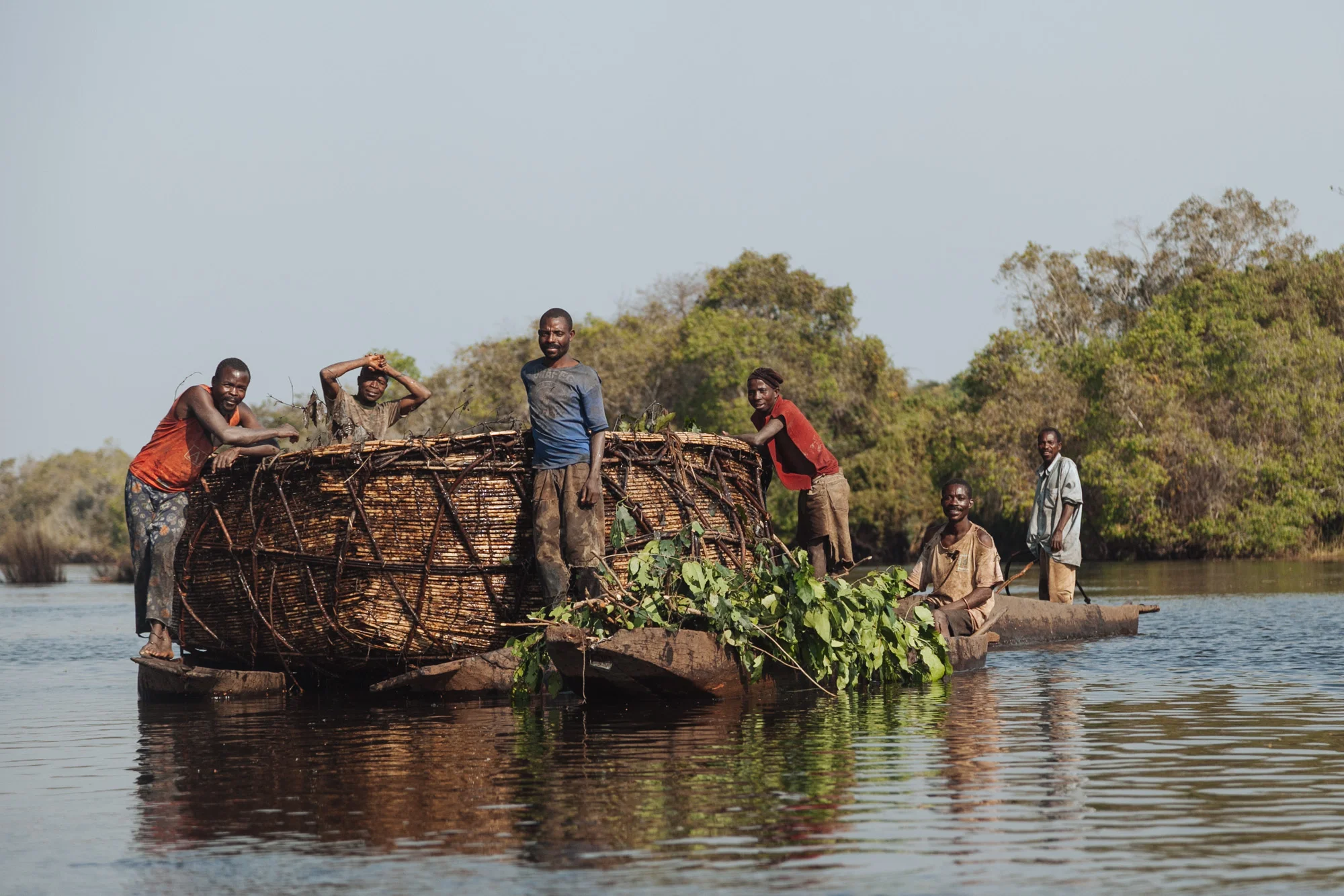 FIshermen gather vegetation to place in their fish nursery.