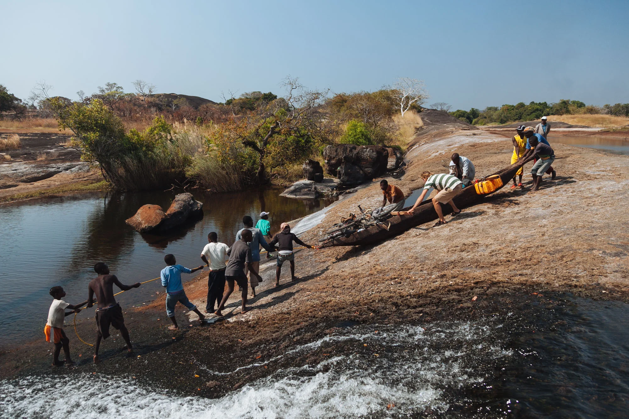 A local village helps us drag our pirogue overland to avoid a large 1km set of rapids.