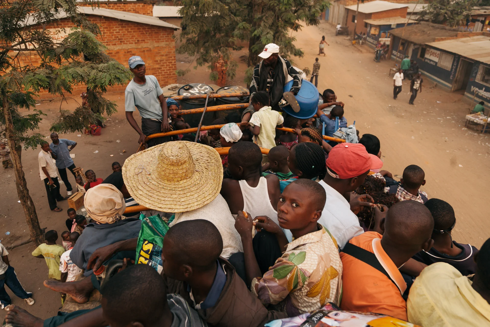 Riding on the trucks is the only motorised way out of Kananga. For some, cycling is the only option and can take them days or weeks to reach their intended destination.