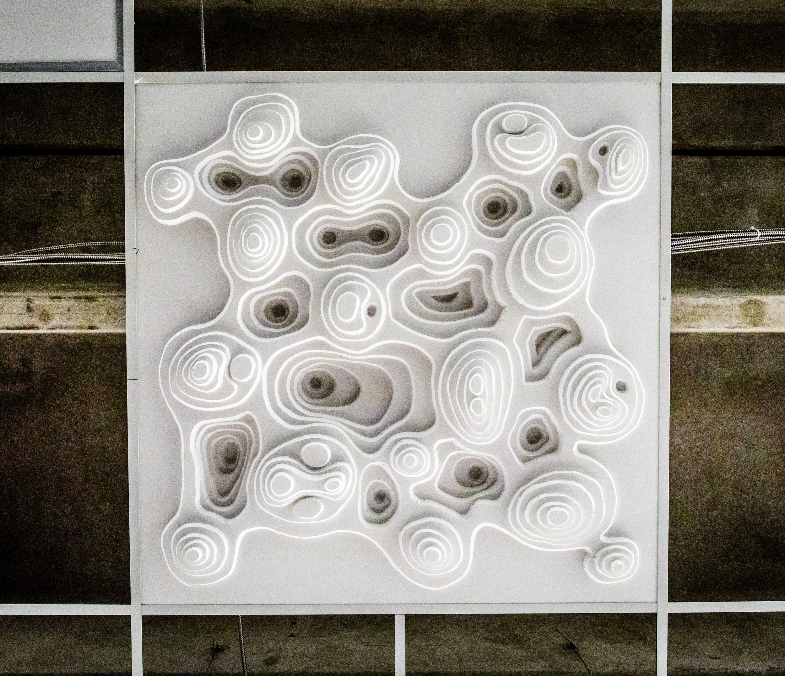 Two of Al B's exemplary three-dimensional tiles adorning the ceiling of Cottonwood Center for the Arts.