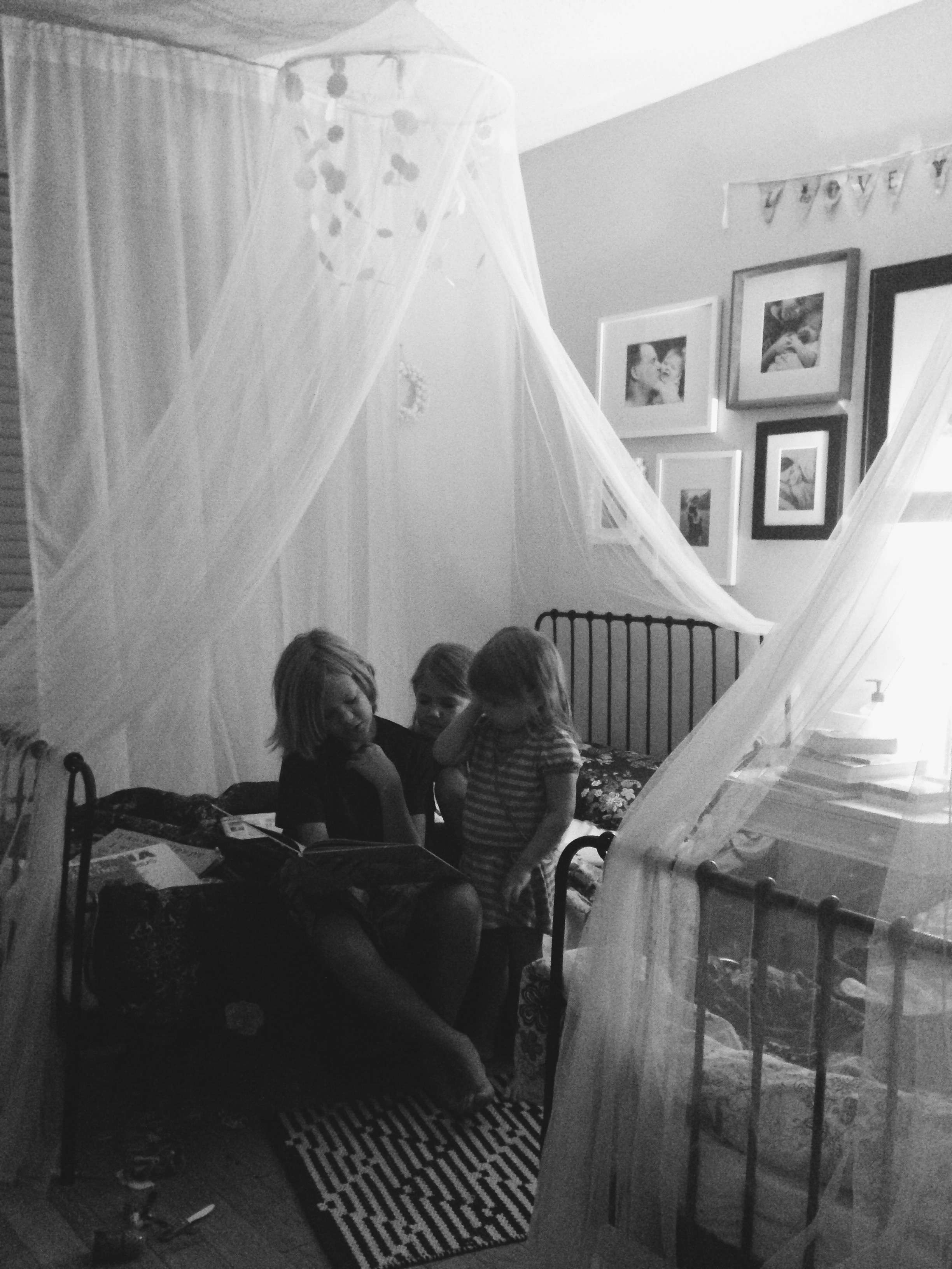 Reading to His Sisters, by Stacey Woods