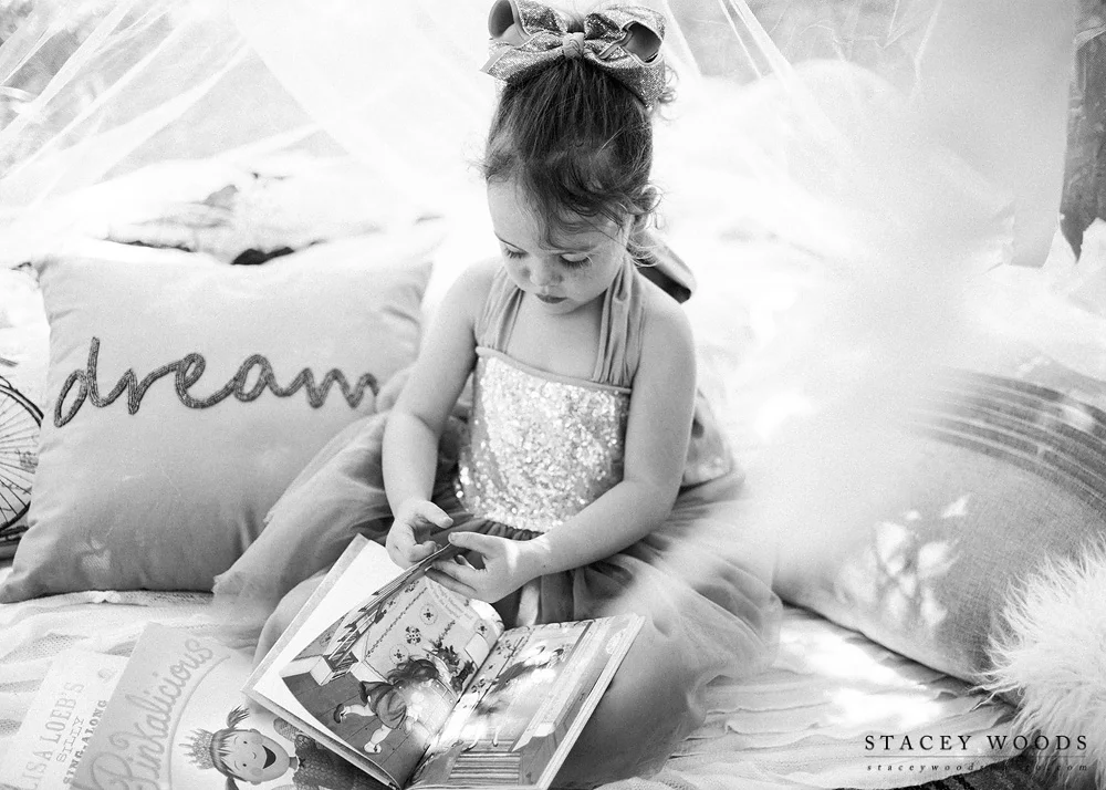 Reading stories under a lighted canopy  || Stacey Woods, Clearwater Florida child photographer