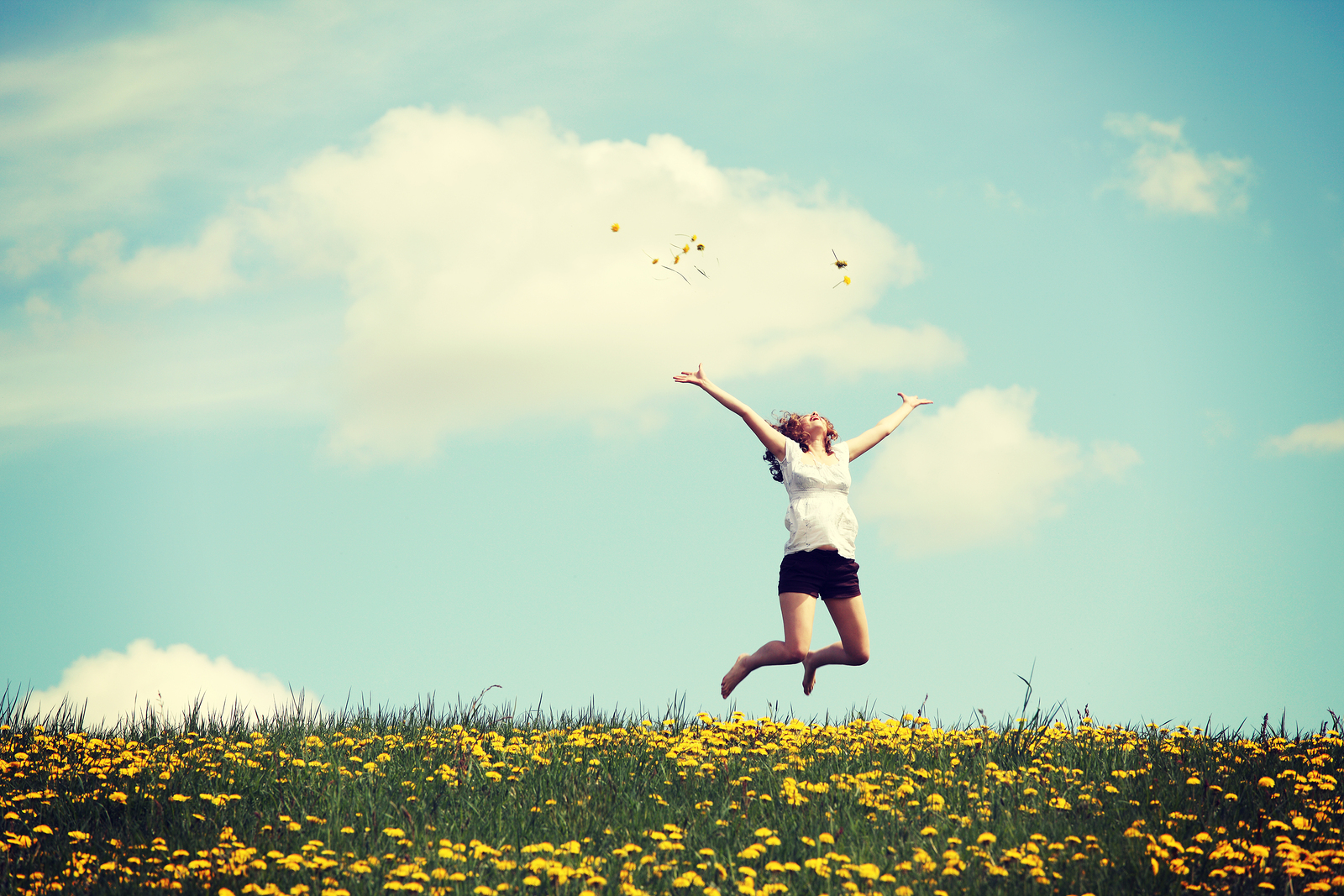 bigstock-Happy-woman-jumping-on-blossom-59295572.jpg