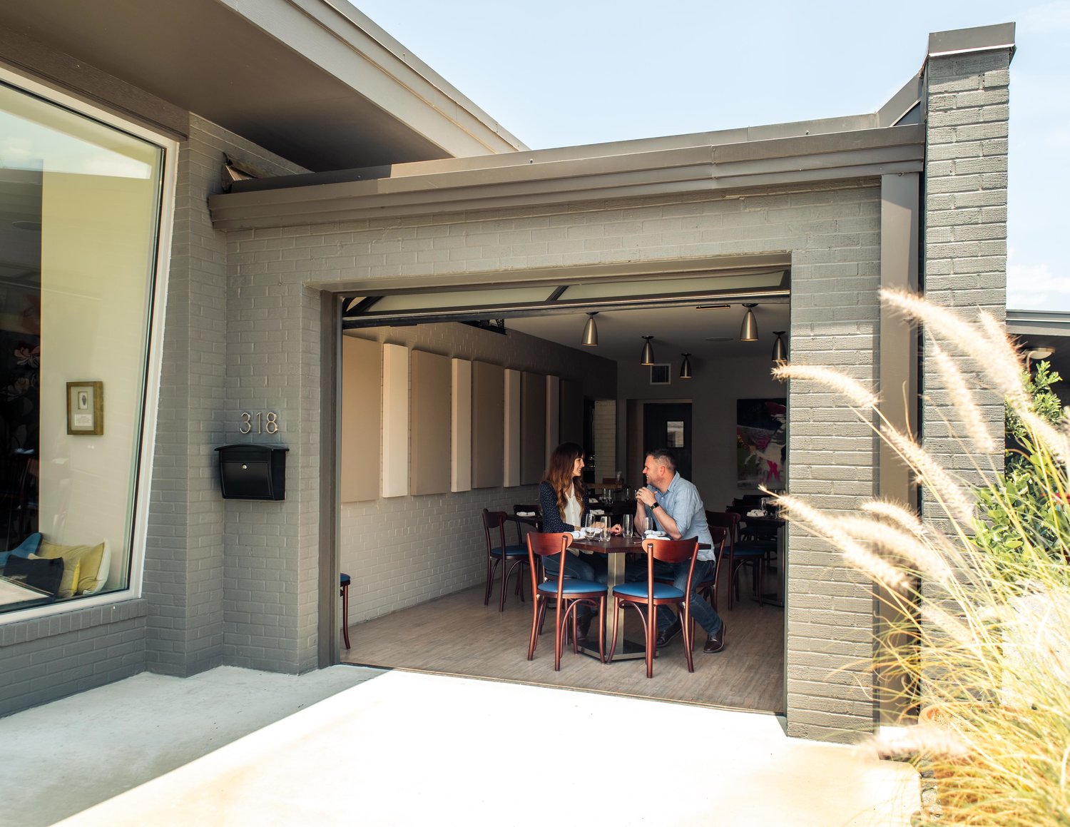 The garage door opens to let the outside in.