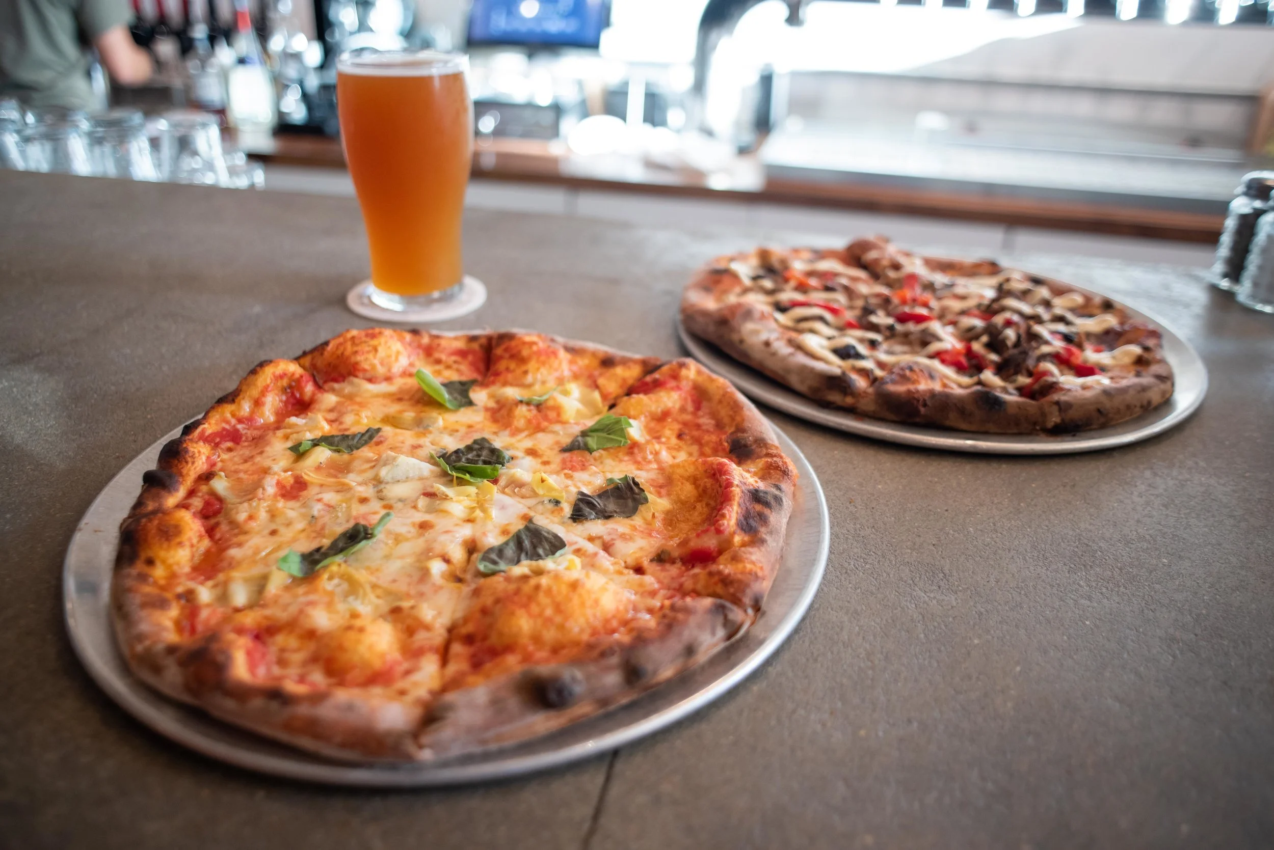 Spicy artichoke and BBQ beef pizzas