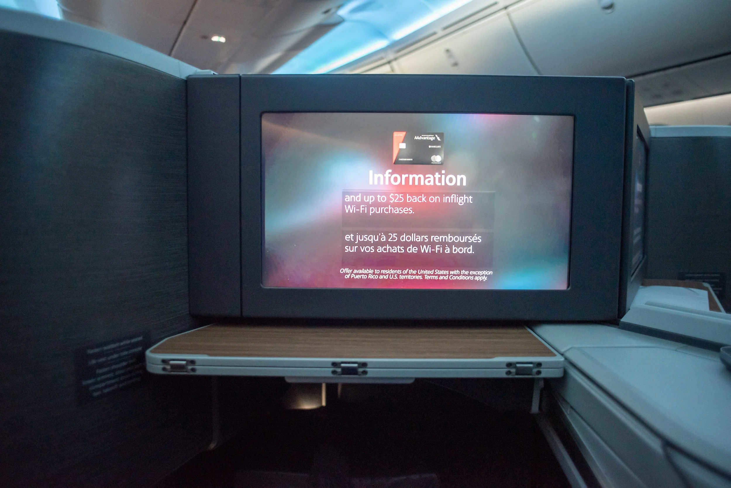 Even in business class, you can’t escape the advertisements.
