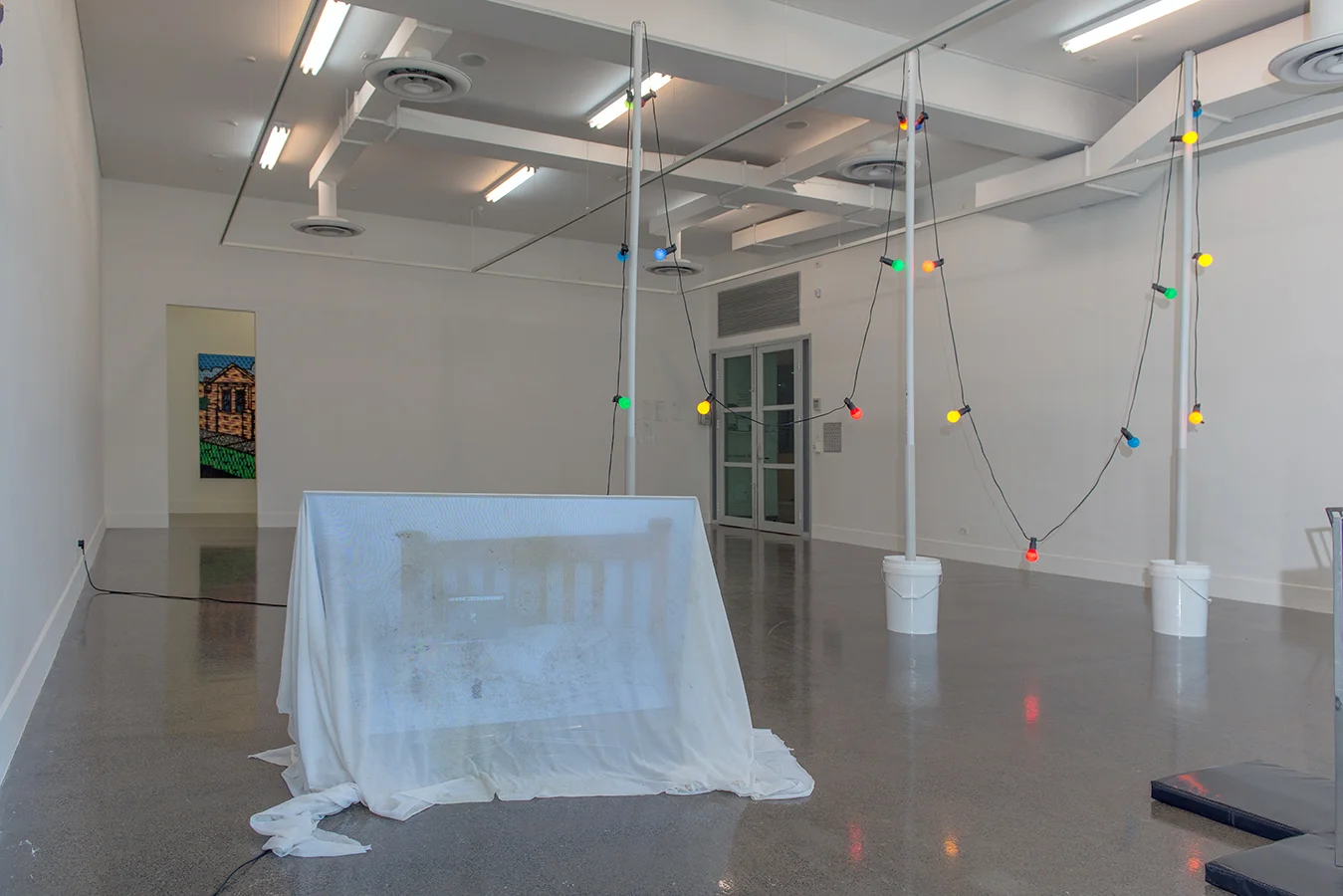Tony Schwensen , Elegy to the Australian Republic ( Motherwell avoids relegation) , 2003, concrete, pvc, buckets, lights. Courtesy the artist and Sarah Cottier Gallery. Natasha Madden, Be My Love (Macbook Duet) , 2014, Digital Film on USB, TV, Nanna's Fabric. Courtesy the artist.
