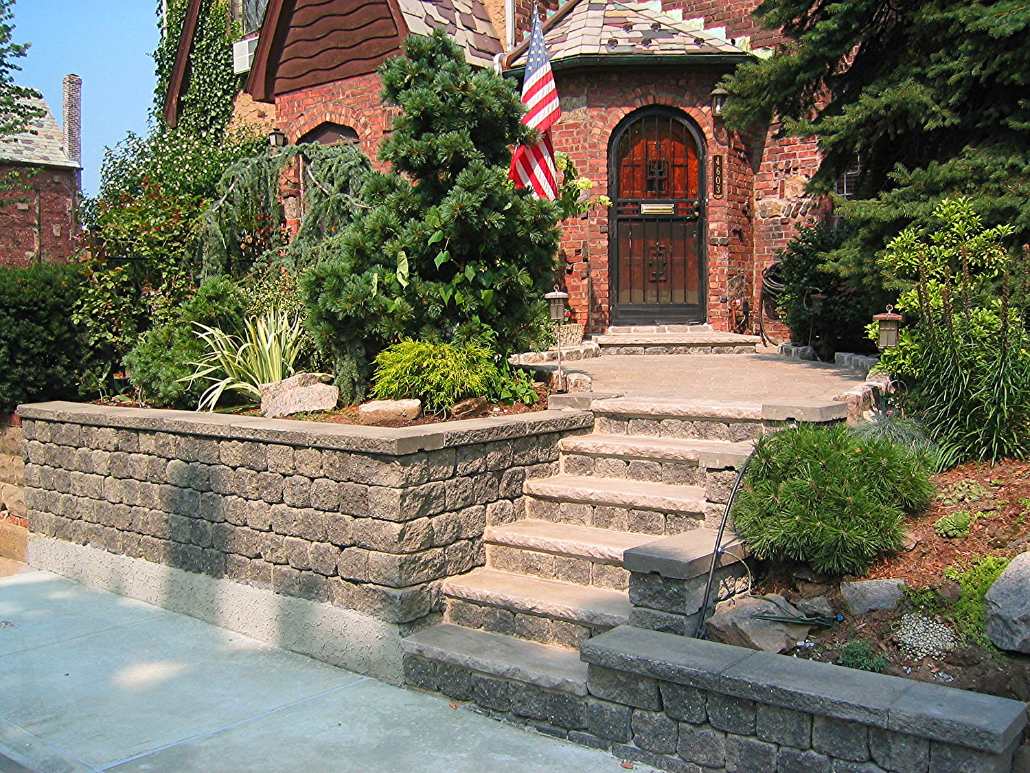 Dry stack walls with limestone treads. Paver walkway with cobblestone borders. 