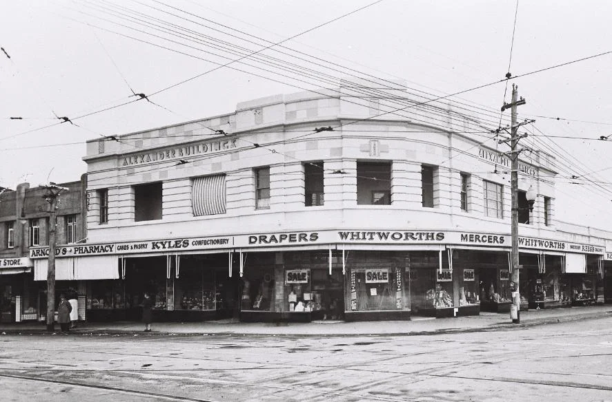 Arnold’s Pharmacy – to the left of the photo