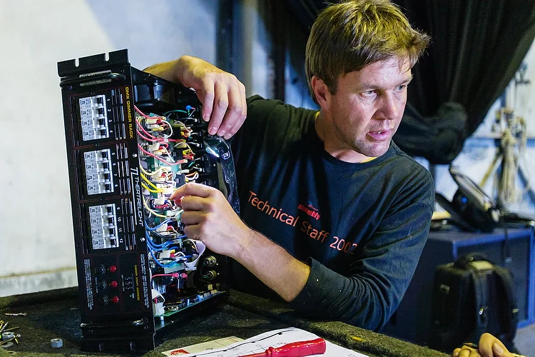 Technical production manager Steve Crowcroft fixes a lighting pack at Shed 6.