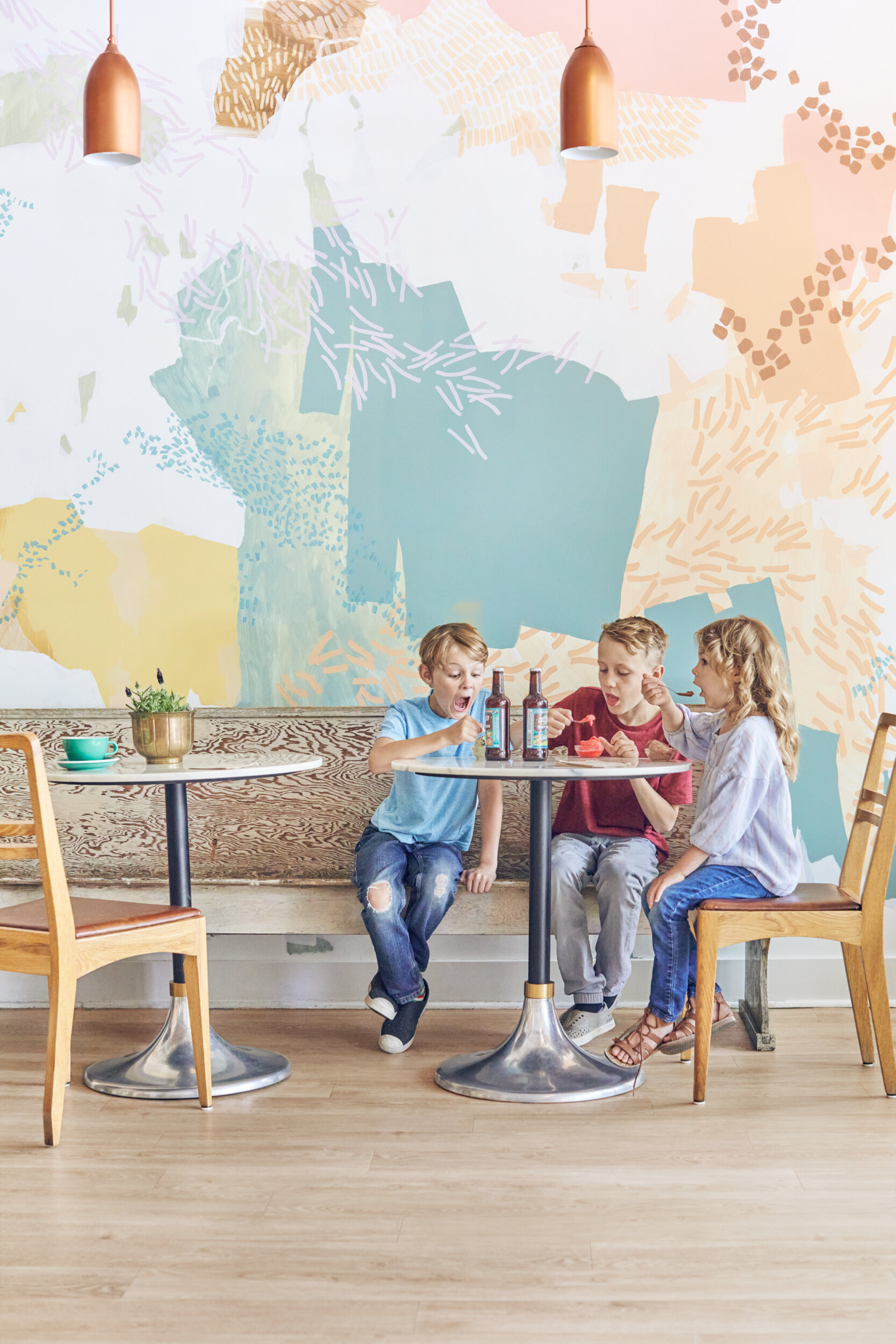  Three children have fun eating gelato at Cold Front Gelato in Nanaimo, British Columbia, Canada 