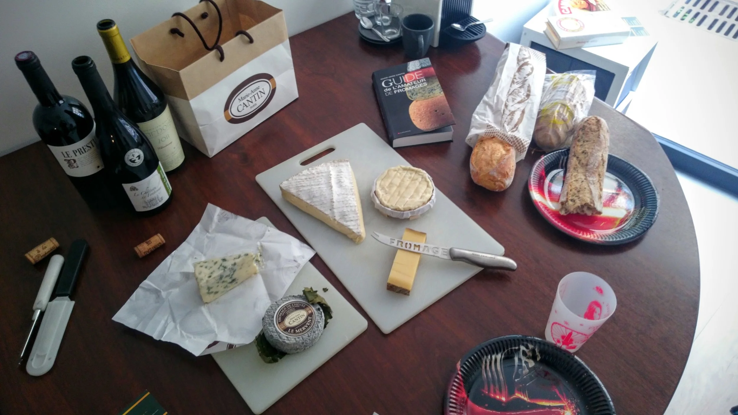 The spread as it looked at my office, with various wine and cheese pairings. The Star Wars plates add to the class! (It's all I had.)