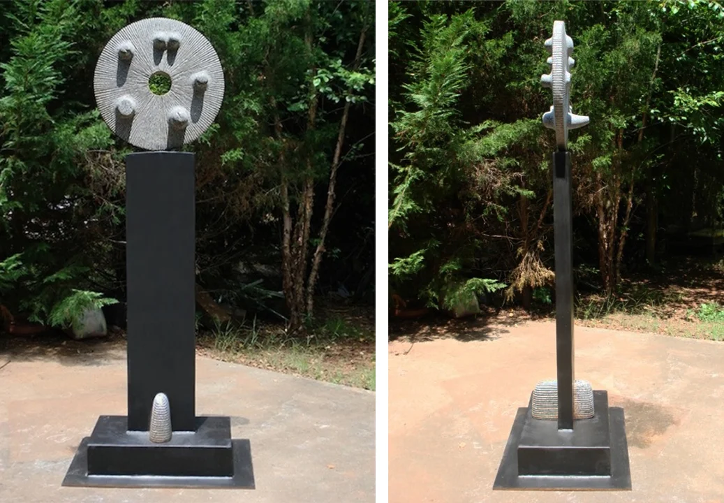 Genesis granite and painted steel, 7' high. A metaphor for cosmic creation. 