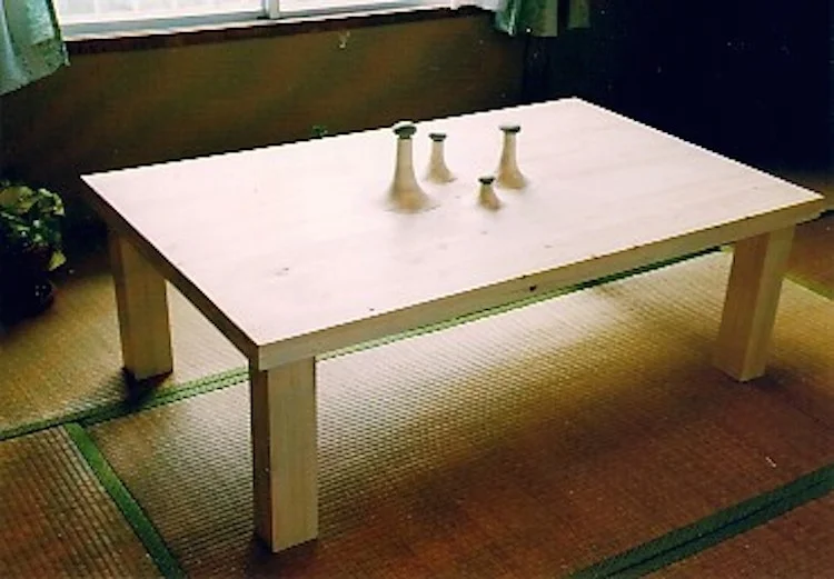 Table with Stone Japanese pine and beach pebbles, about 6’ long