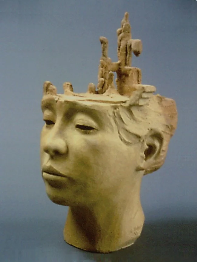   Nagasaki &nbsp; unglazed stoneware, 16" high.&nbsp;Portrait of the artist's wife whose family lived in Nagasaki before, during and after the bombing. The family survived though their house was destroyed. It begets the question … Was it necessary to