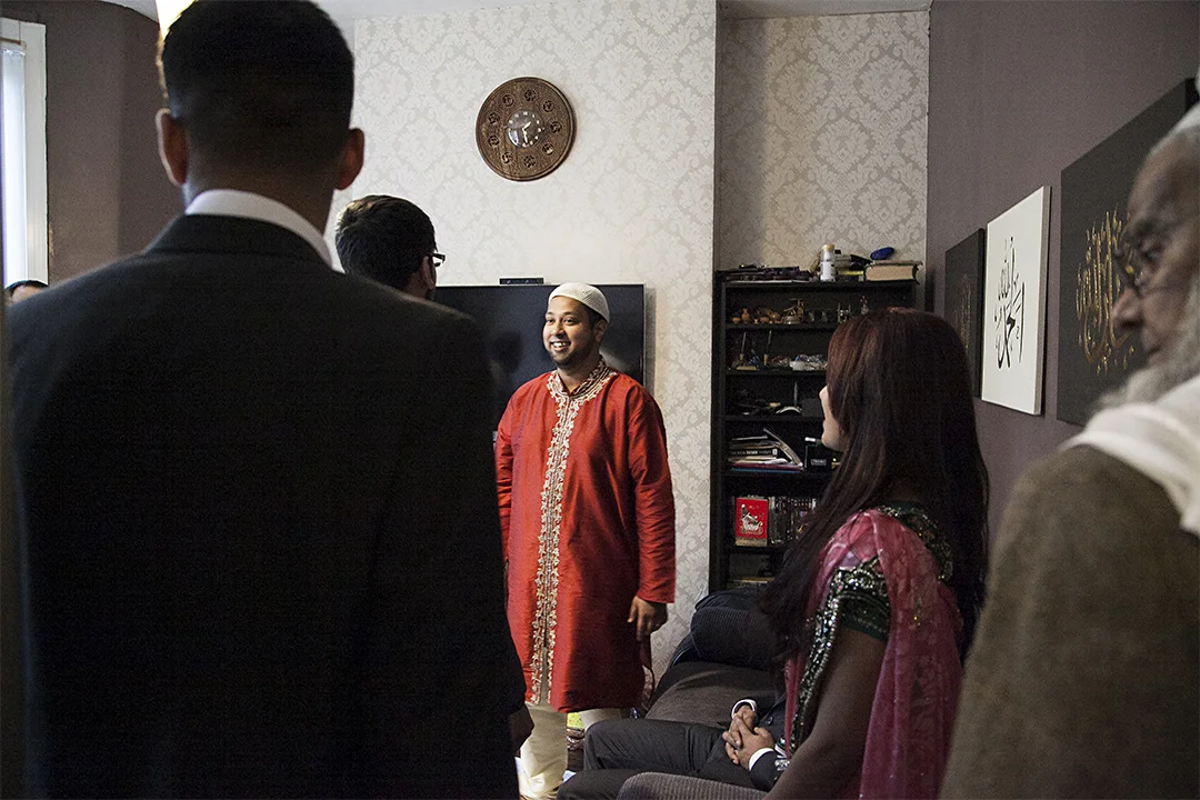 The Groom The groom waits downstairs in the living room and welcomes guests into the family home.