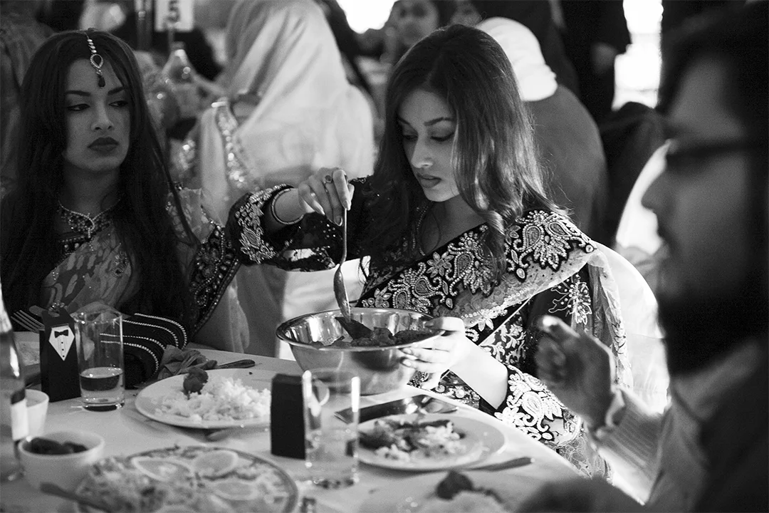Guests Enjoy Food The groom enjoys a banquet of traditional Bengali food, including rice and curries. Contrary to, for example Christian weddings, this take place before the bride has arrived and married the groom.