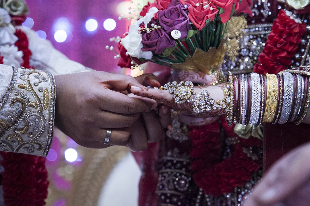 Exchanging of rings. Once the bride and groom have met on stage, an exchanging of rings takes place.