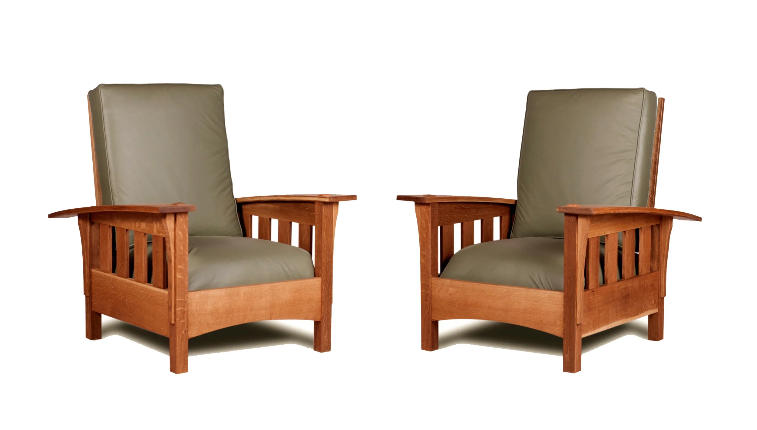 TWO OF EIGHT MORRIS CHAIRS MADE FOR DELBARTON MONASTERY IN NEW JERSEY.