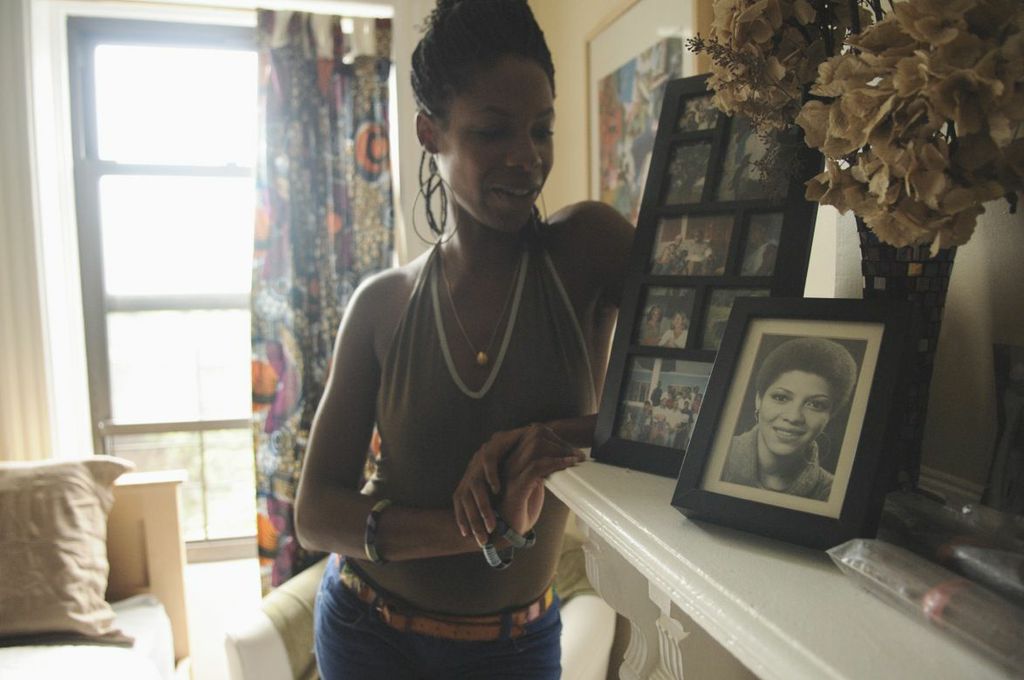 “It would be next to impossible without my collective family,” Kakembo admits. “It’s literally a village effort. He spends time with his dad, his dad’s mom, my mom, his cousins, his dad’s brother... It seems to work itself out. Fortunately we all work together and he keeps us all together. It ends up being a beautiful thing because he ends up seeing the family so frequently.” A photo of Nasozi's mother on display on her mantle.