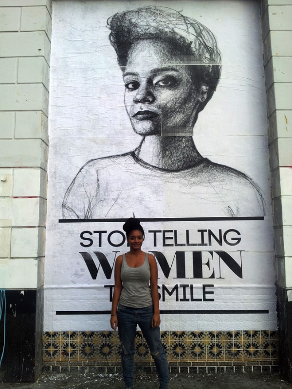 Tatyana Falalizadeh in front of her own portrait.