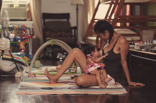 Poet and activist Staceyann Chin breastfeeding her daughter Zuri. Photo credit: J. Quazi King