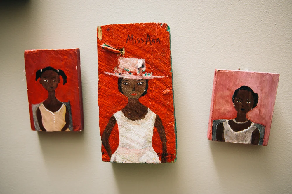 Her books and accomplishments notwithstanding, one only needs to take a look around the Millner home to see her other great pride and joy: her children. The wall adjacent to her staircase is adorned with art featuring black children. Some of the colorful pieces were drawn by her own children, and others are originals from folk or fine artists. “I’m infatuated by those pictures because I think there’s nothing more beautiful than brown children who are happy, living out loud, and enjoying childhood,” Millner explains.