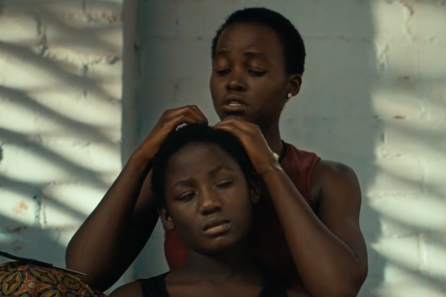 A still from the movie Queen of Katwe starring Lupita Nyong'o and newcomer Madina Nalwanga.
