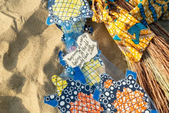 “My mother made the broom for our wedding. On it, she placed turtles and messages towards our life together. This message embodies our journey from abortion to union and beyond.” (Photo credit: ShocPhoto Imagery )