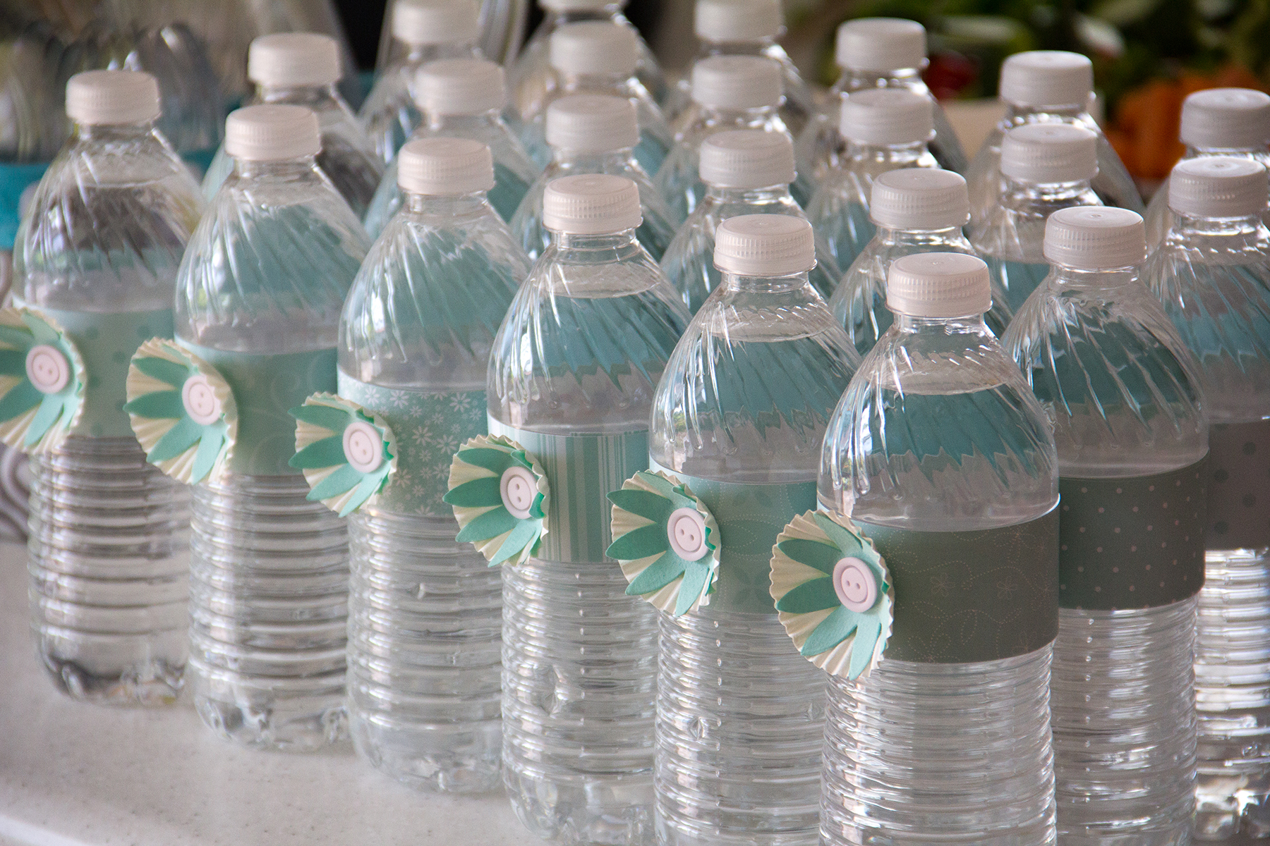 Simple decorated water bottles (paper flower with button & patterned patter belly band)