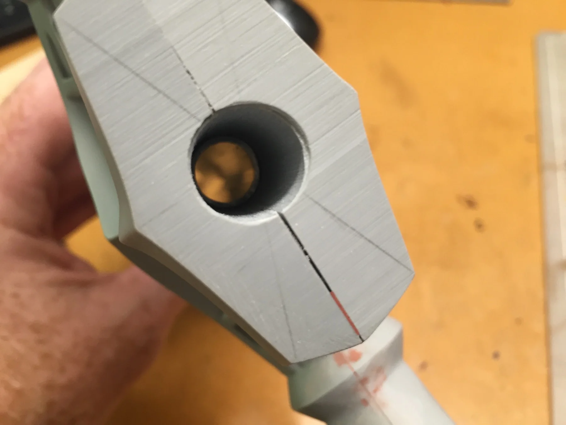 Drilled out center of crossguard to accommodate the aluminum pipe.
