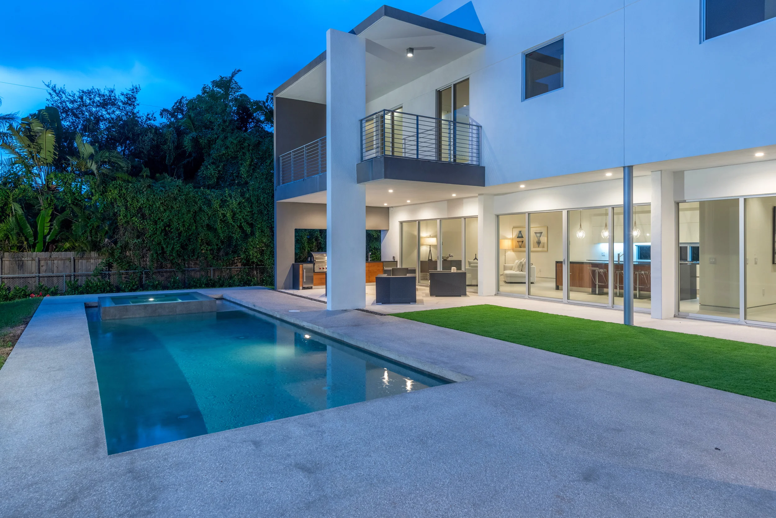 The Setting Homes Plum House Miami Florida Exterior Pool Night TARIS Real Estate
