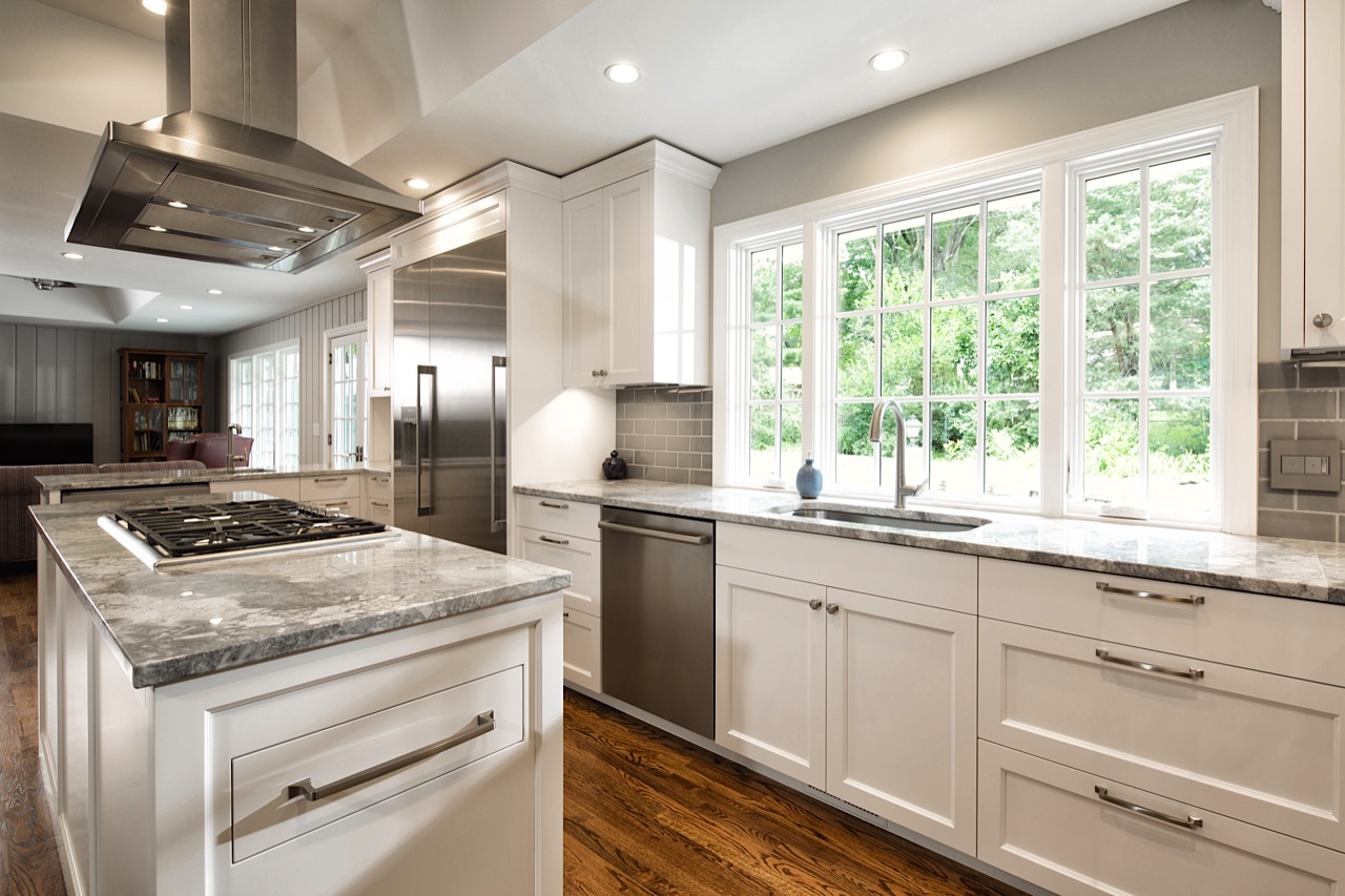 As previously mentioned, the client loved natural light in the kitchen. We removed the old window, and upgraded to a larger, fully integrated, fiberglass window. The countertop comes flush with the bottom of the frame, maximizing the light entering the space. The two sides are operable, and an air switch disposal is mounted into the fixed window frame for a clean, integrated design.
