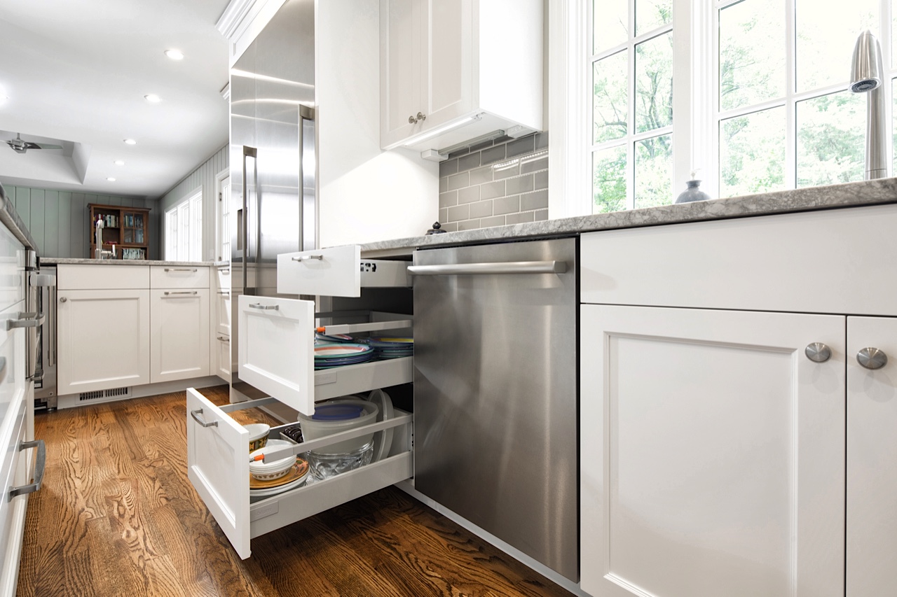 Functionality: Dish storage next to the dishwasher, with drawer heights optimized for the homeowner’s unique dinnerware. Stainless steel finish extends from the faucet, to appliances, to pulls, to ceiling fan. A subtle backsplash and clean undercab lighting unify the design.