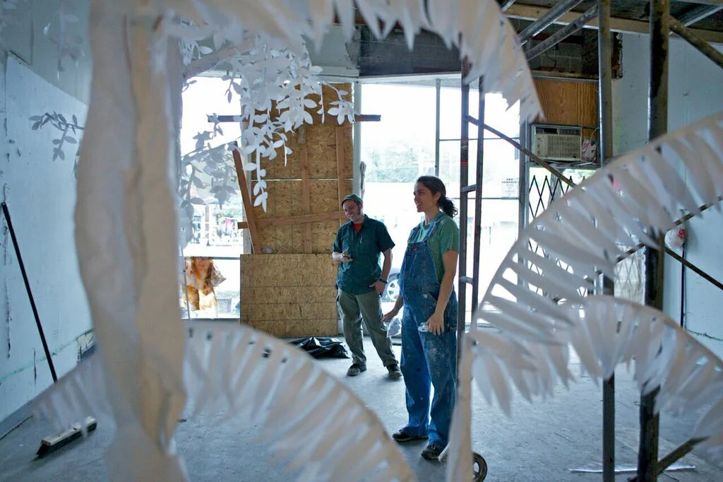 Artist Carrie Walker created Ghost Jungle , a dream-like paper installation addressing the way nature will reclaim a building when given enough time, water, and light - by beginning with merely a seed.