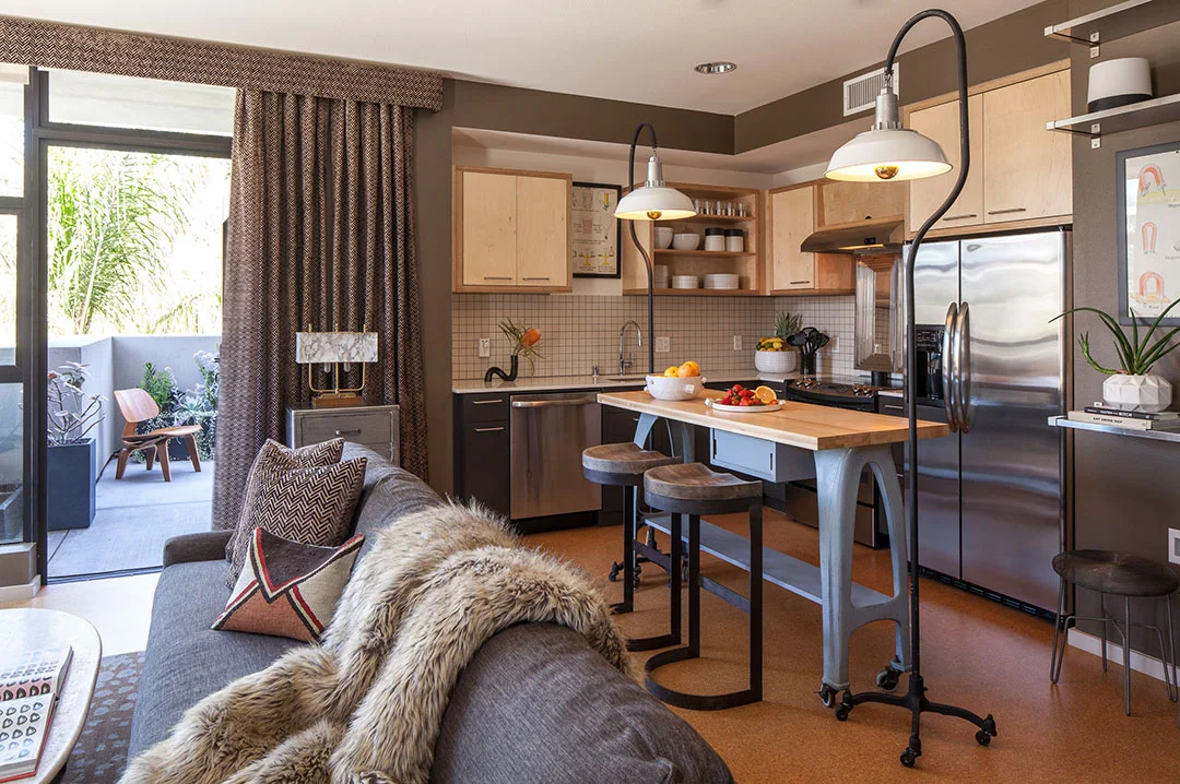 Kitchen island and industrial lighting designed by We Came In Peace. 