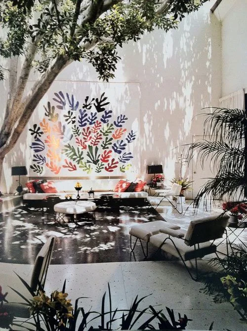 Large scale outdoor art grounded by living room clusters