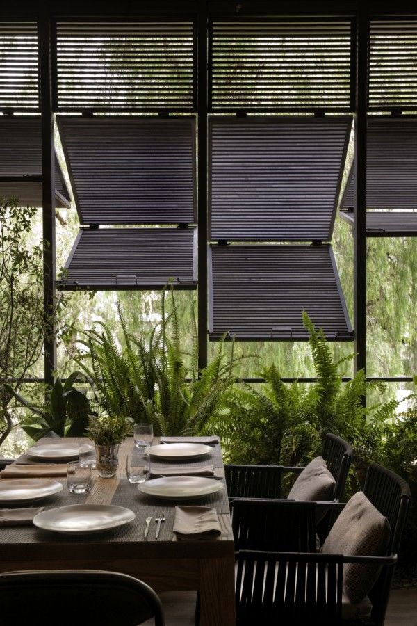 Convertible shutters become awnings, creating open breezeways