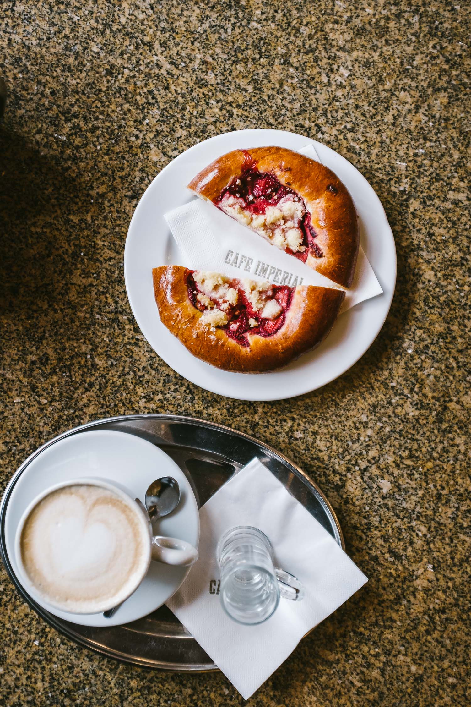 Cafe Imperial / Brioche with raspberries and a cup of milk coffee.