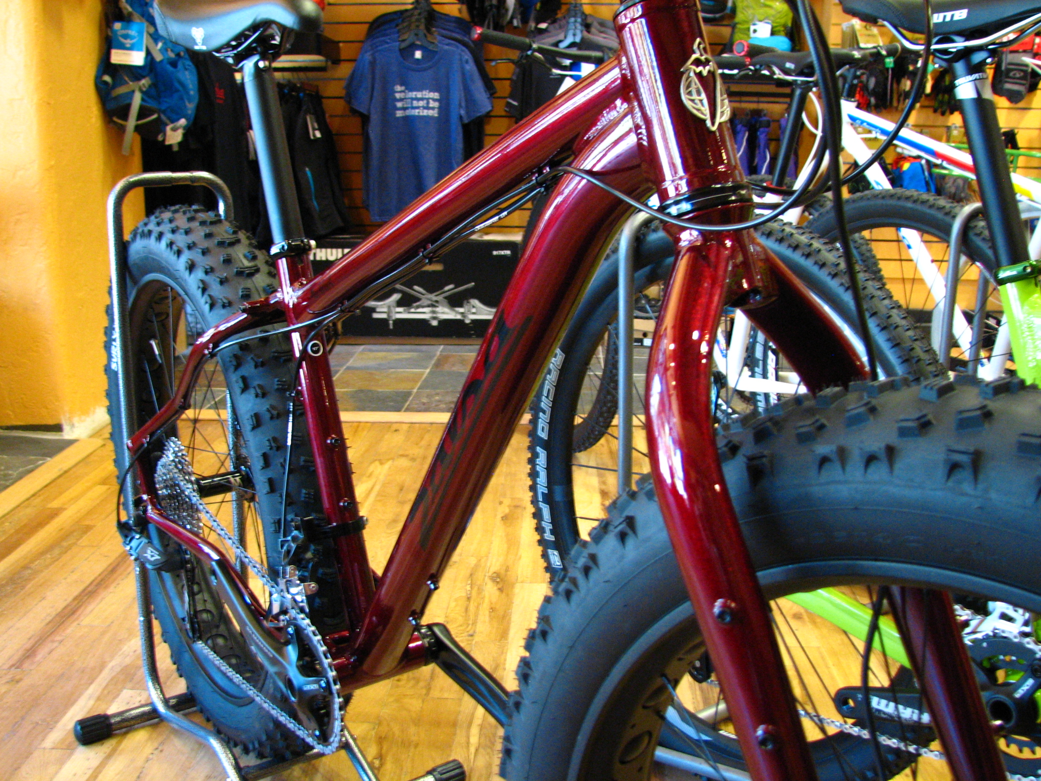 Mukluk 3 in Ruby Red. For 1900 bucks, this thing is a pretty screamin' deal - 82mm rims, Nate tires, tapered fork, nice drivetrain, and hydraulic brakes.