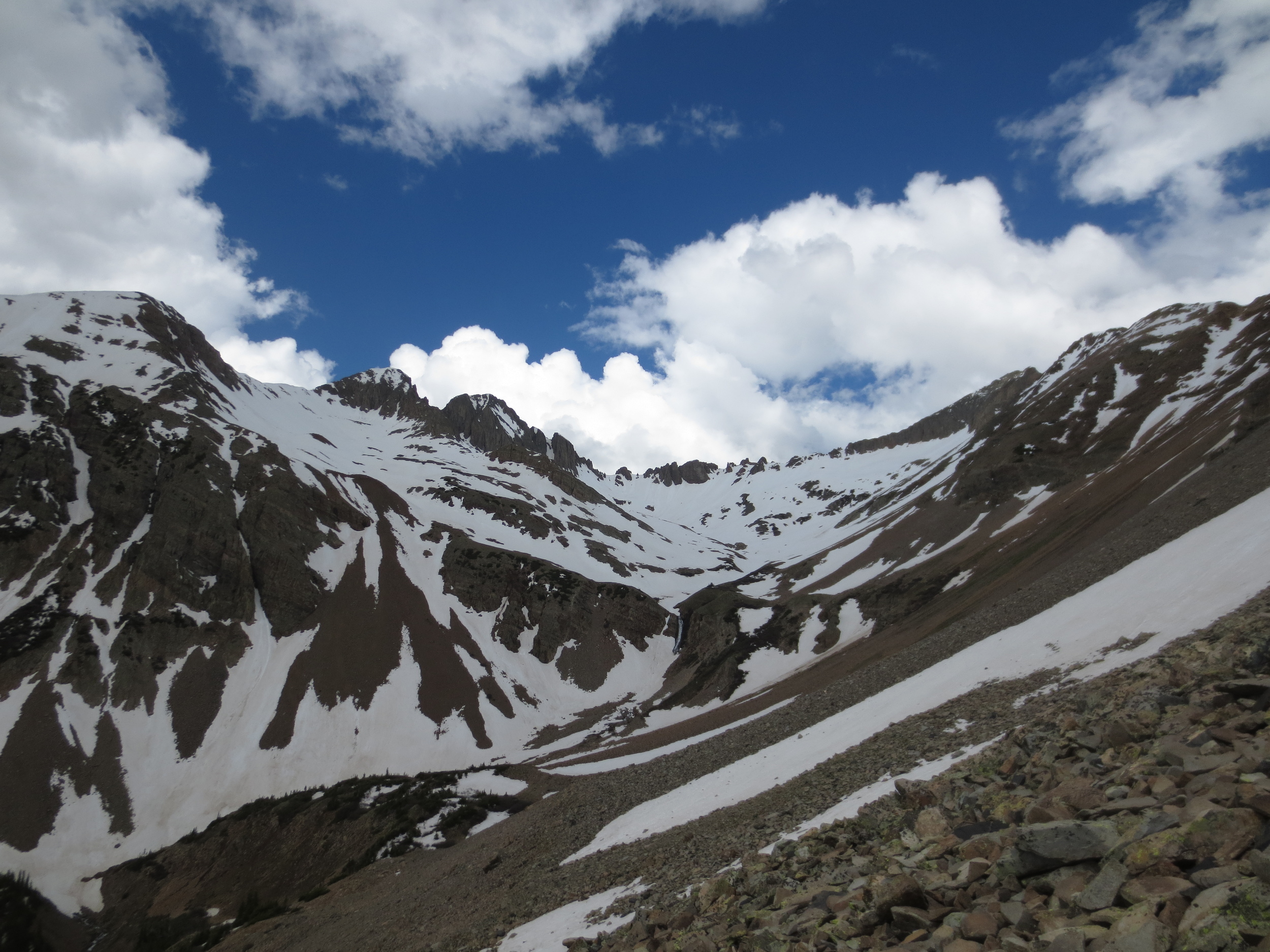 Current snowpack in Tomahawk Basin, approximately the same aspect and elevation as Blackhawk Pass. No way we're getting mountain bikes over that without somebody getting pissed off or injured.