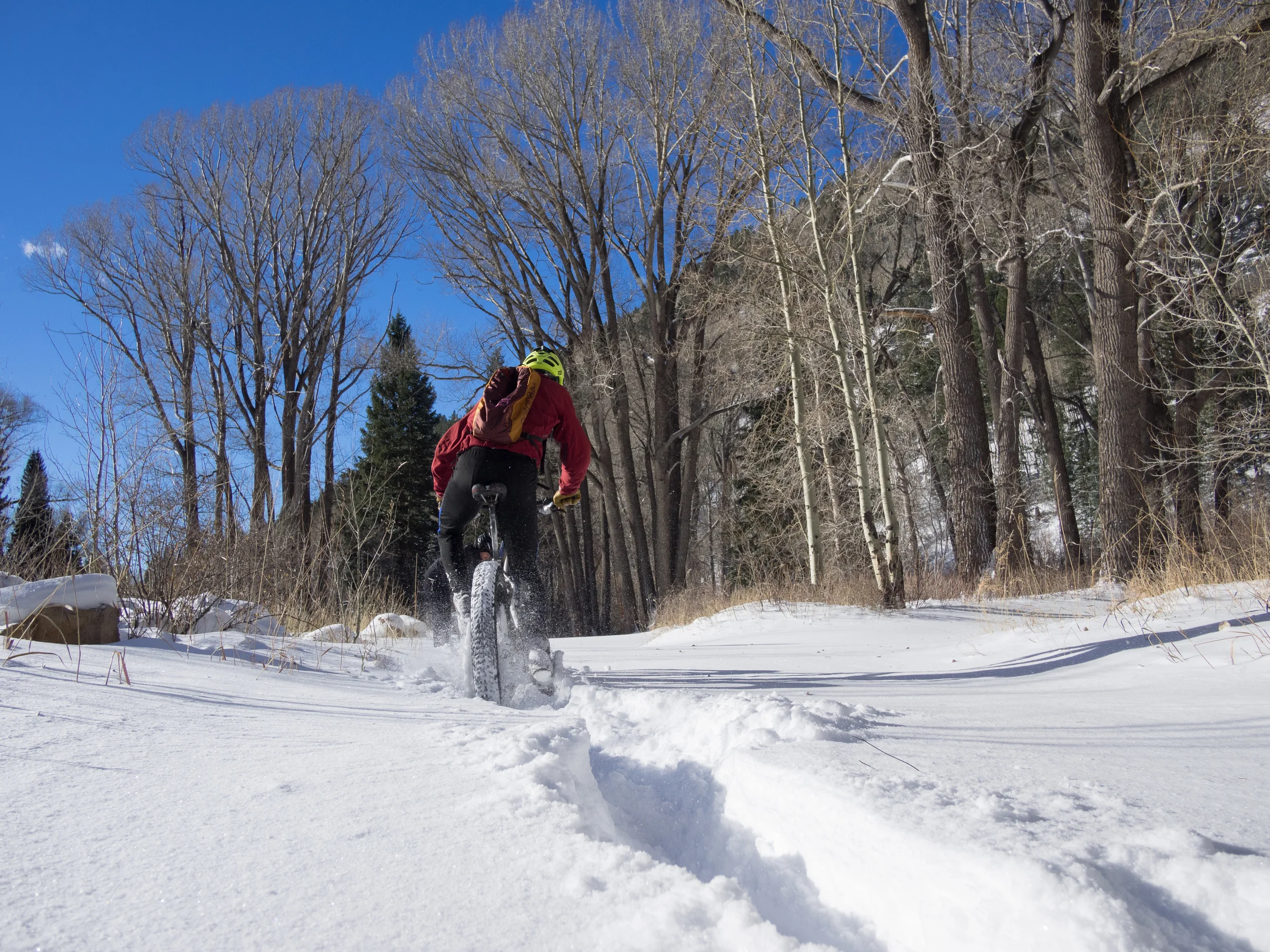 The snow was flying as the big wheels were rolling.