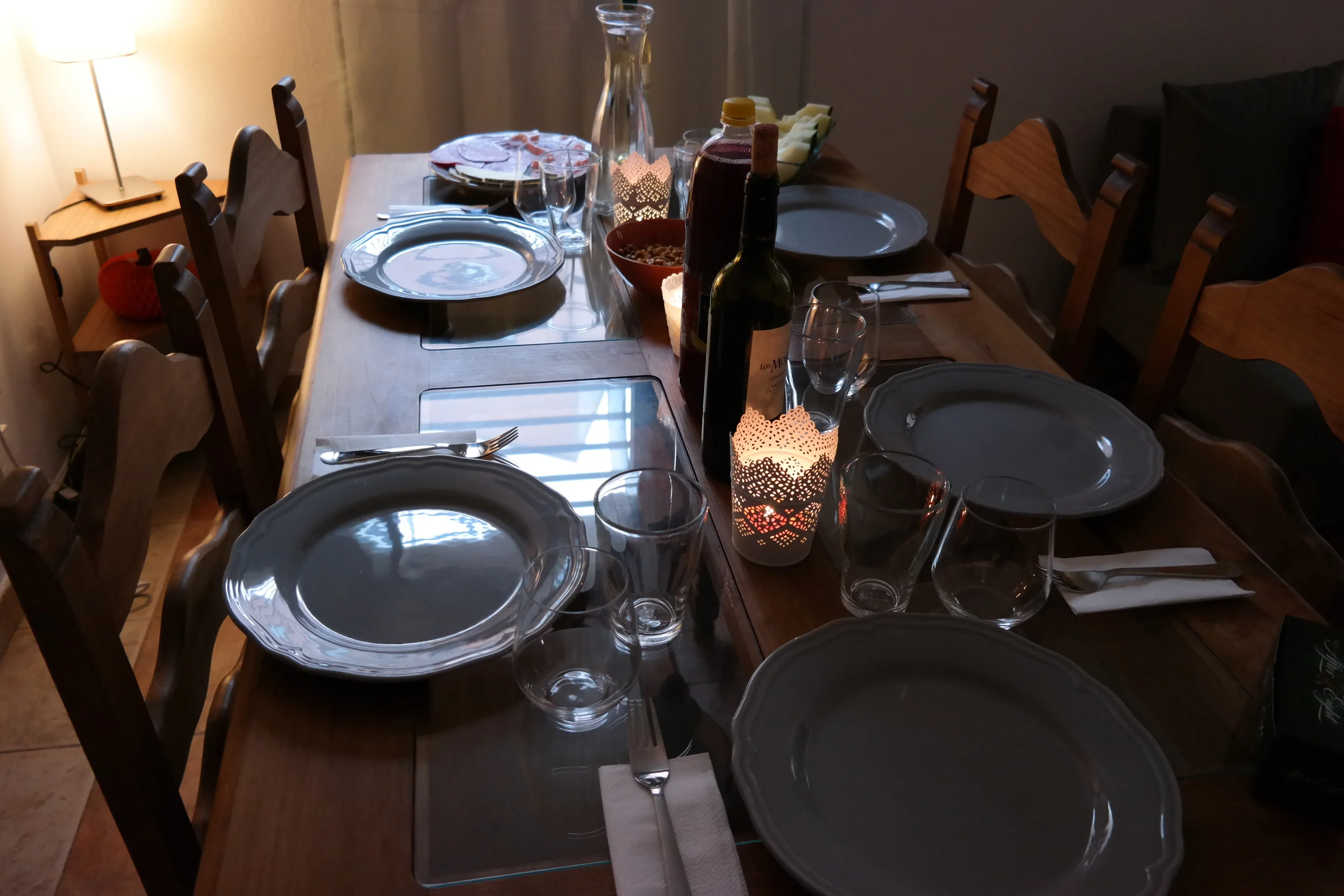 A table set for five. We can't have any more than six people here because we don't have enough plates, cups, utensils, etc. ;)